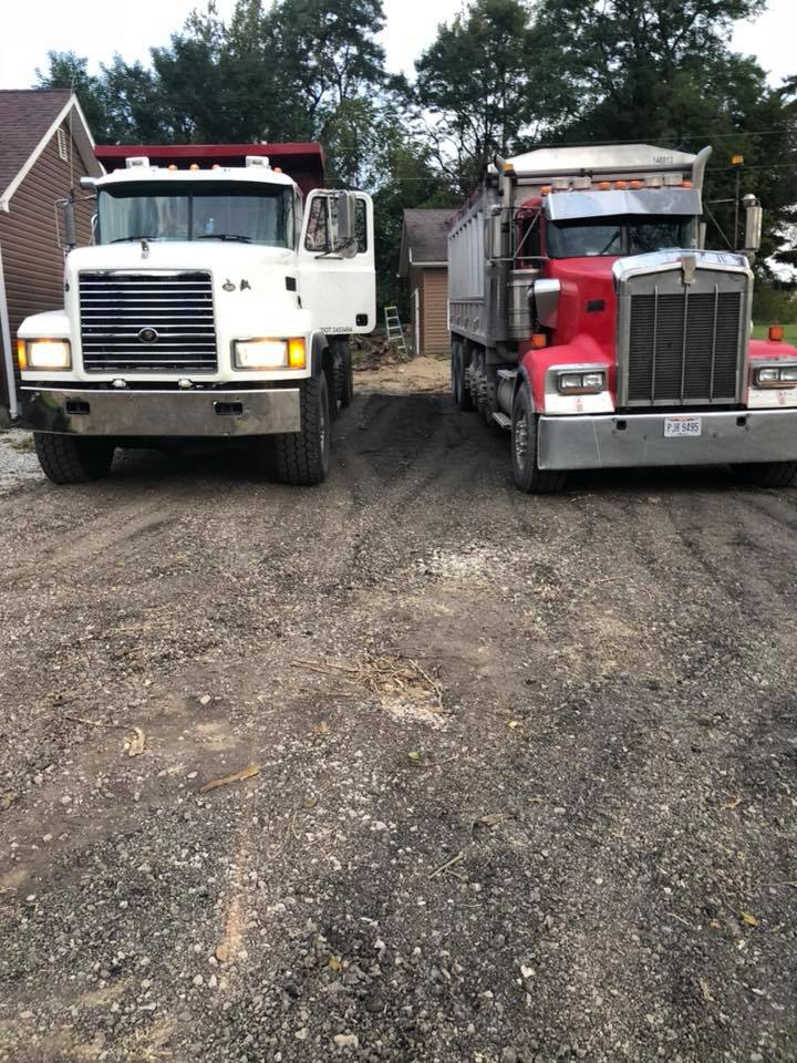 two hauling trucks side by side